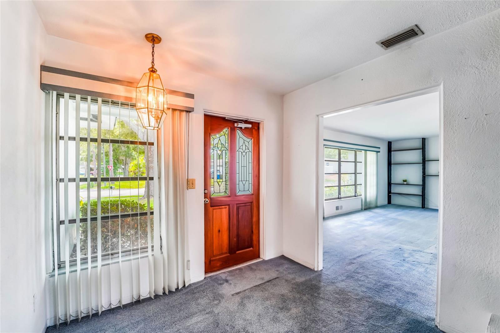 Front area foyer! Beautiful leaded glass door