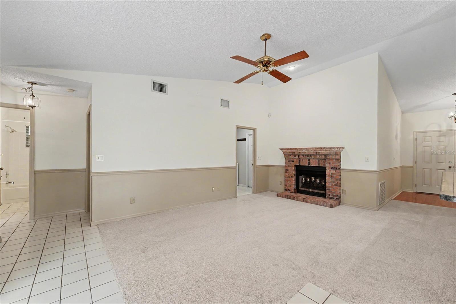 Split plan two bedrooms and bath and laundry leads to garage