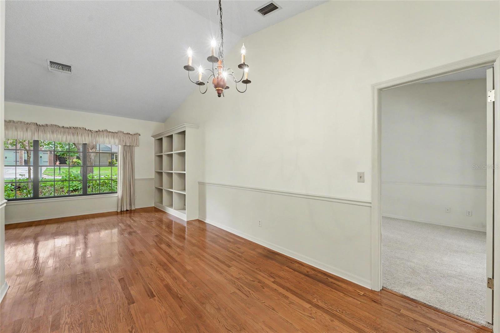 view from dining room. Primary bedroom on the right