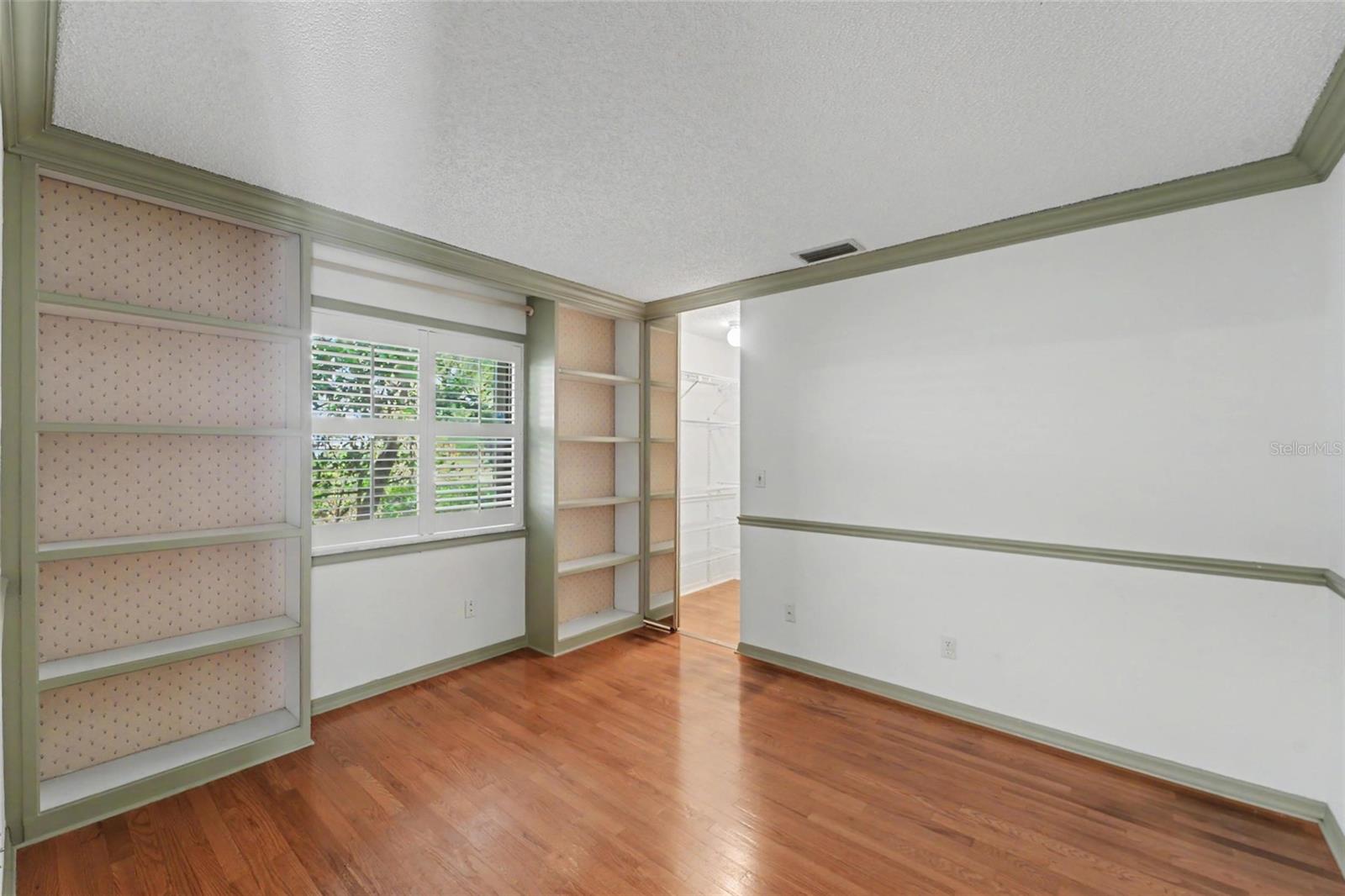 3rd bedroom with built ins and walk in closet