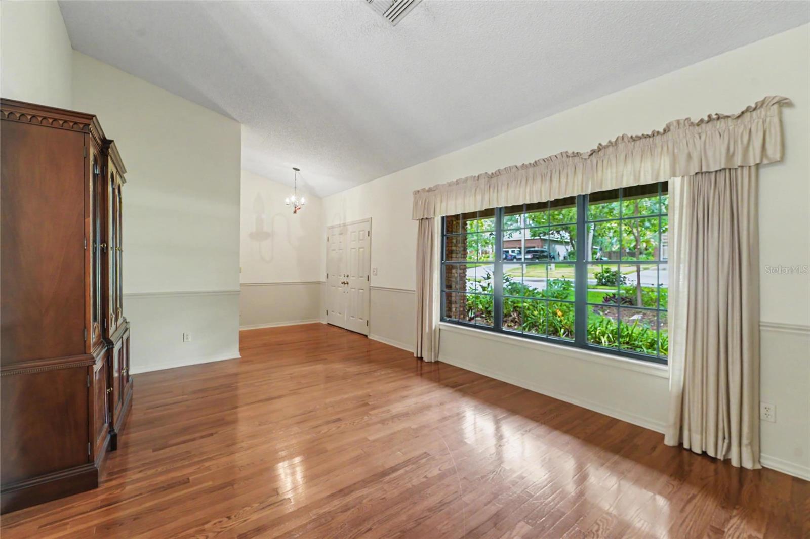 Notice double front doors and the hard wood floors