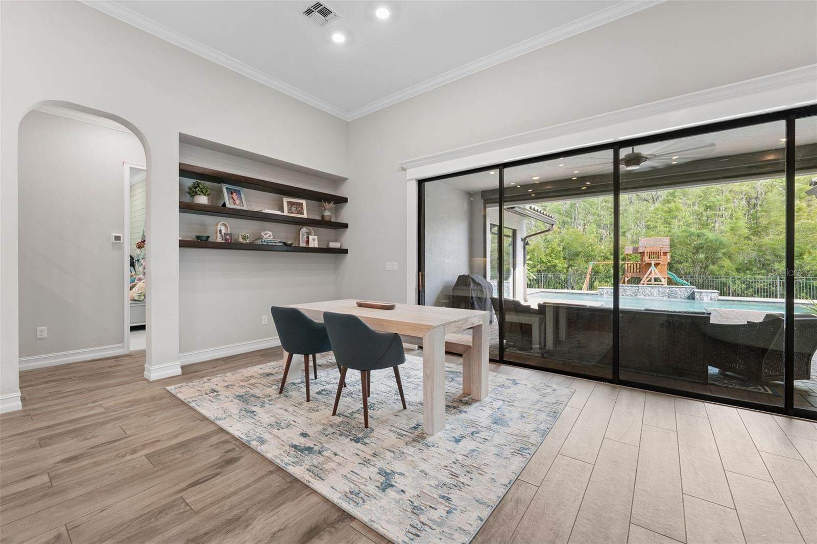 Second dining area is located off of the patio with pool and preserve views.