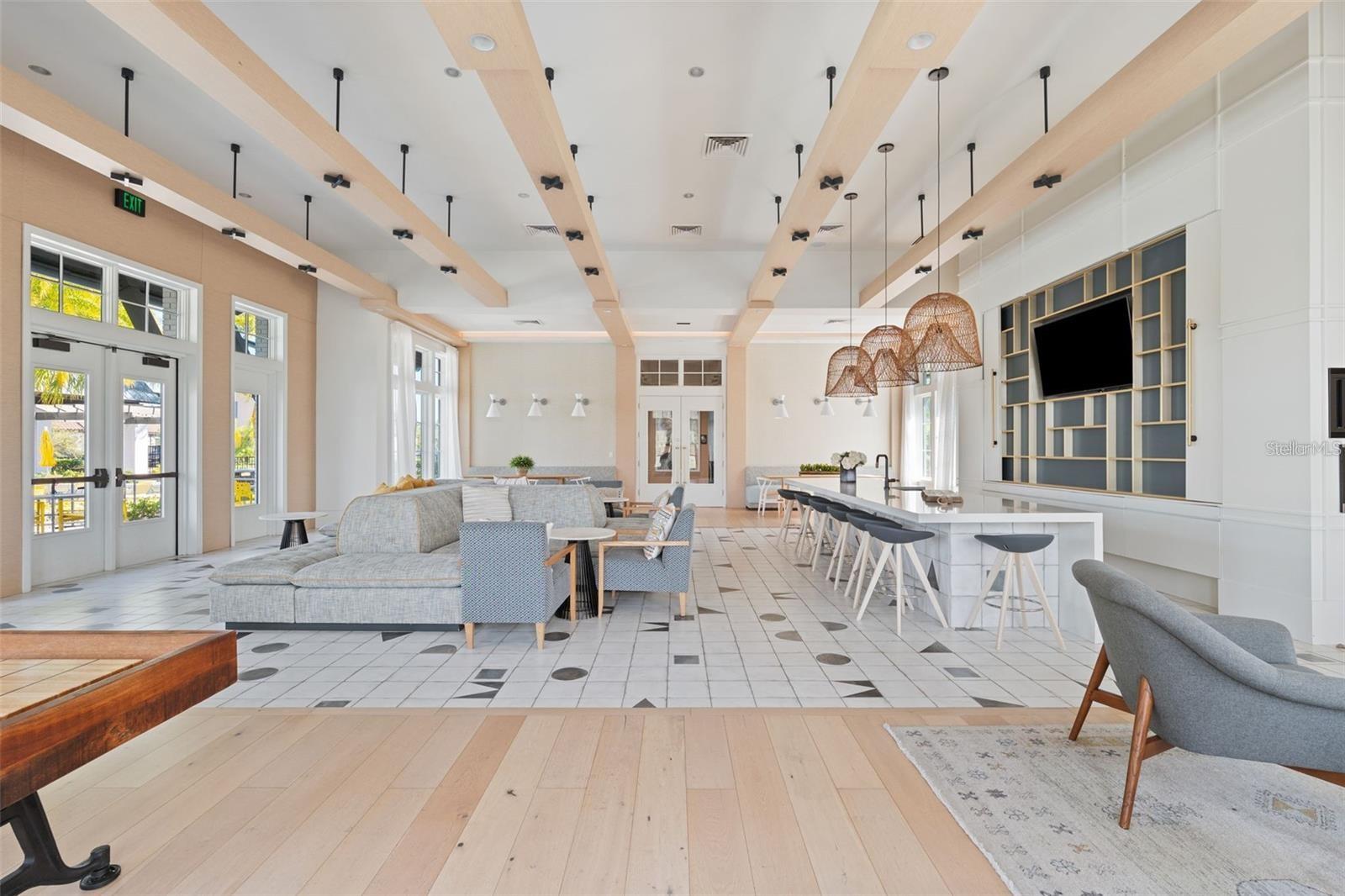 Resort style community clubhouse with a community pool, fitness center and lake front pool.
