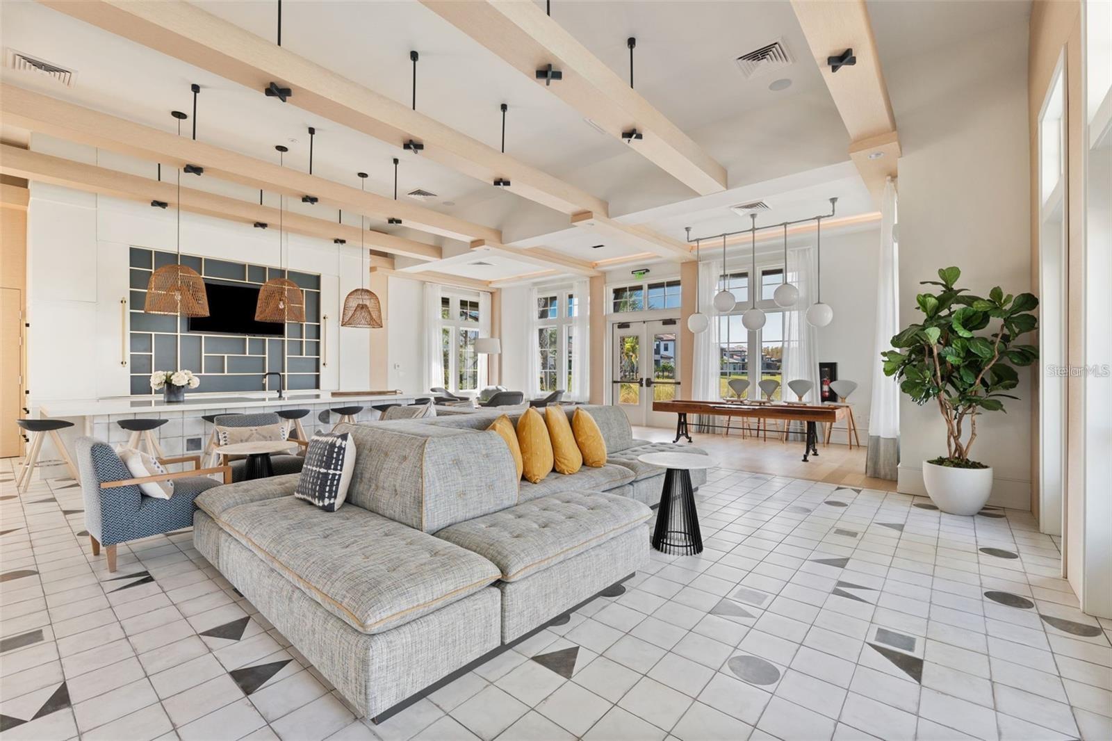 Resort style community clubhouse with a community pool, fitness center and lake front pool.