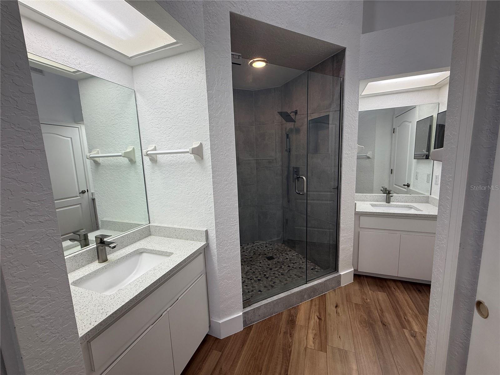 Split vanities with upgraded shower.