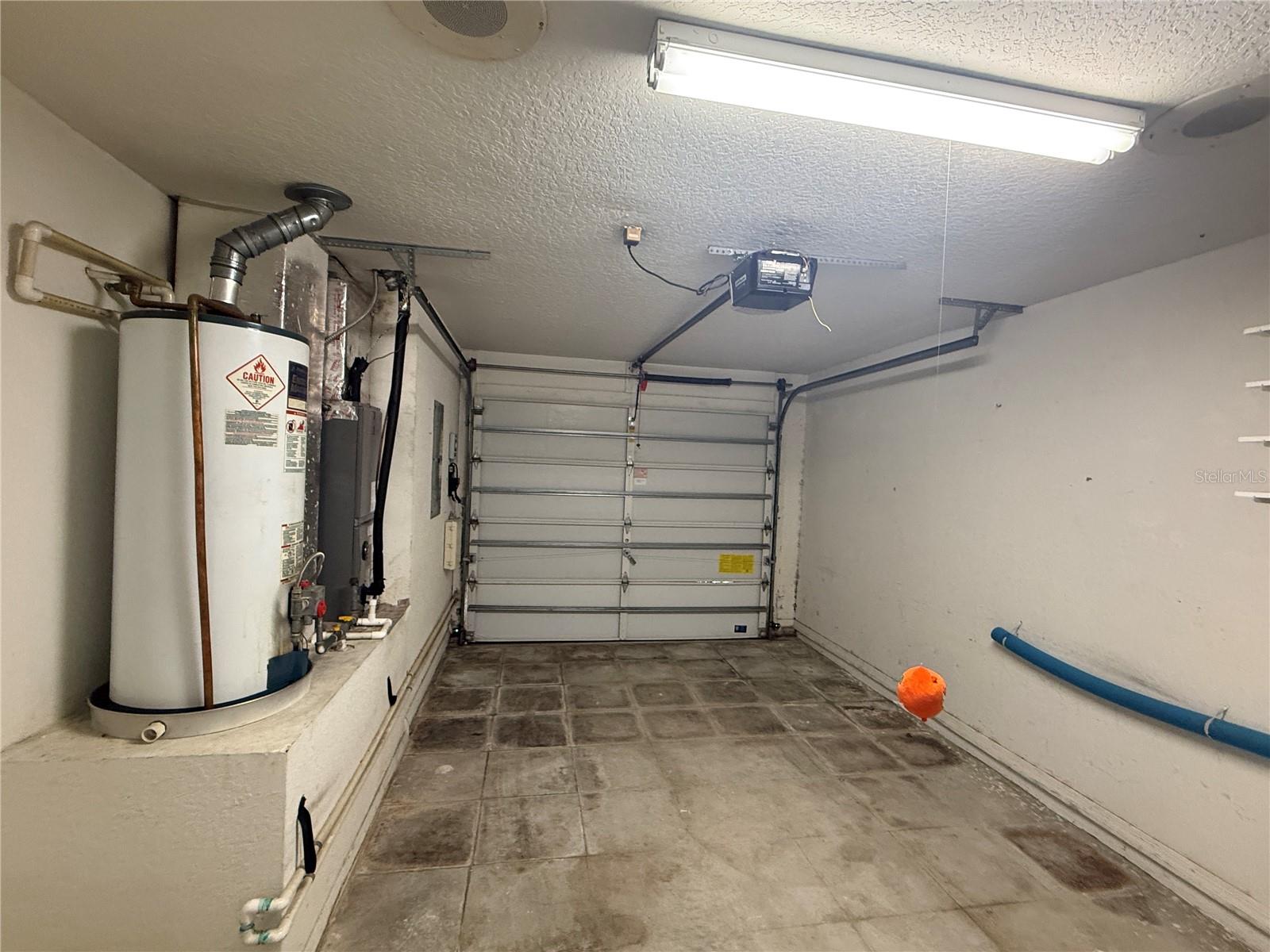 Garage with water heater and AC unit