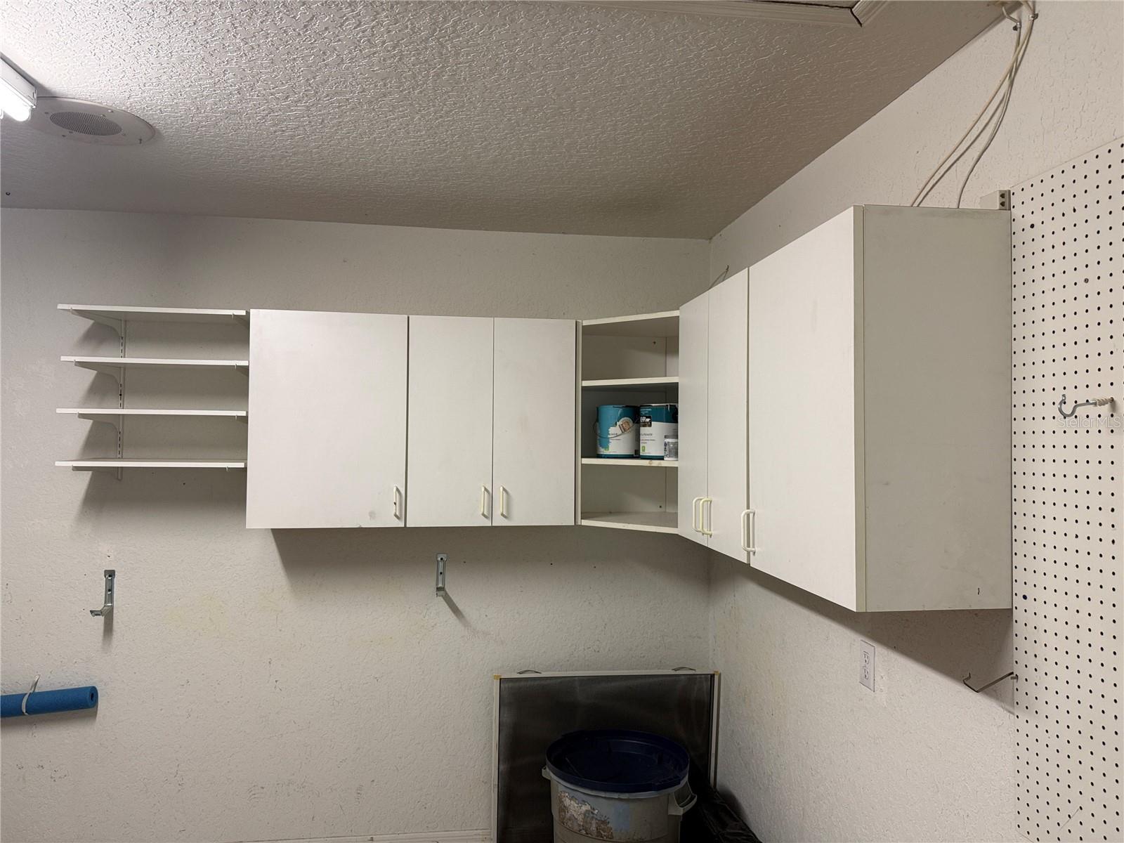 Shelving/cabinets for extra storage in the garage.