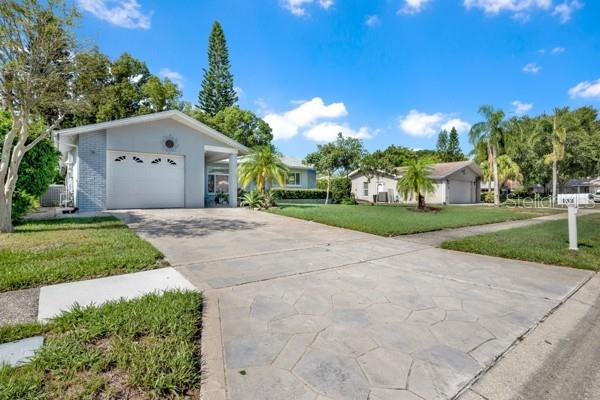 FRONT VIEW WITH GORGEOUS DRIVEWAY