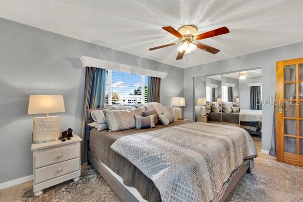 PRIMARY BEDROOM WITH CEILING FAN