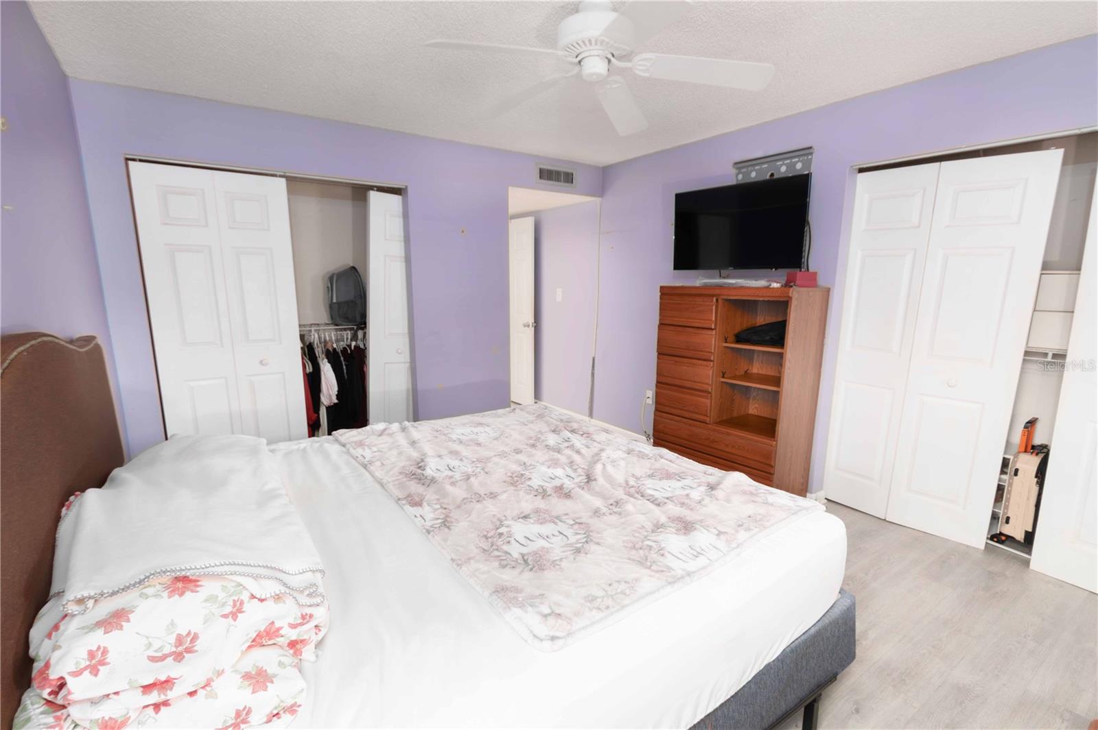 owners bedroom with 2 closets