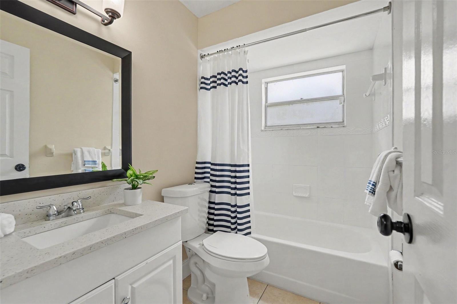 An updated bathroom with a fresh, neutral design.