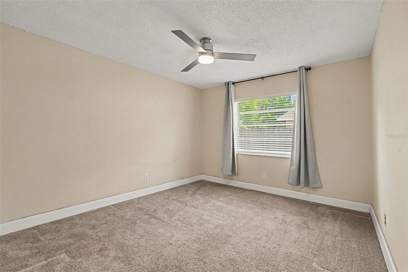 The primary bedroom offers a peaceful retreat with room for your personal style.