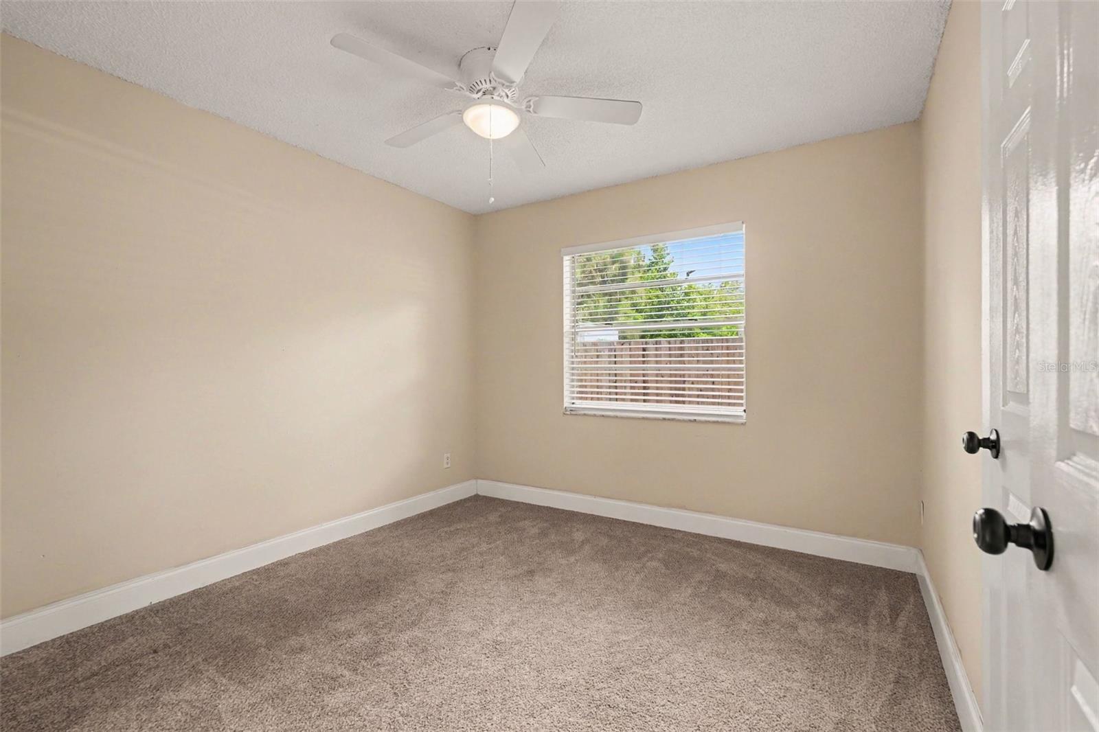 The third bedroom offers flexibility as a home office, hobby room, or guest space.