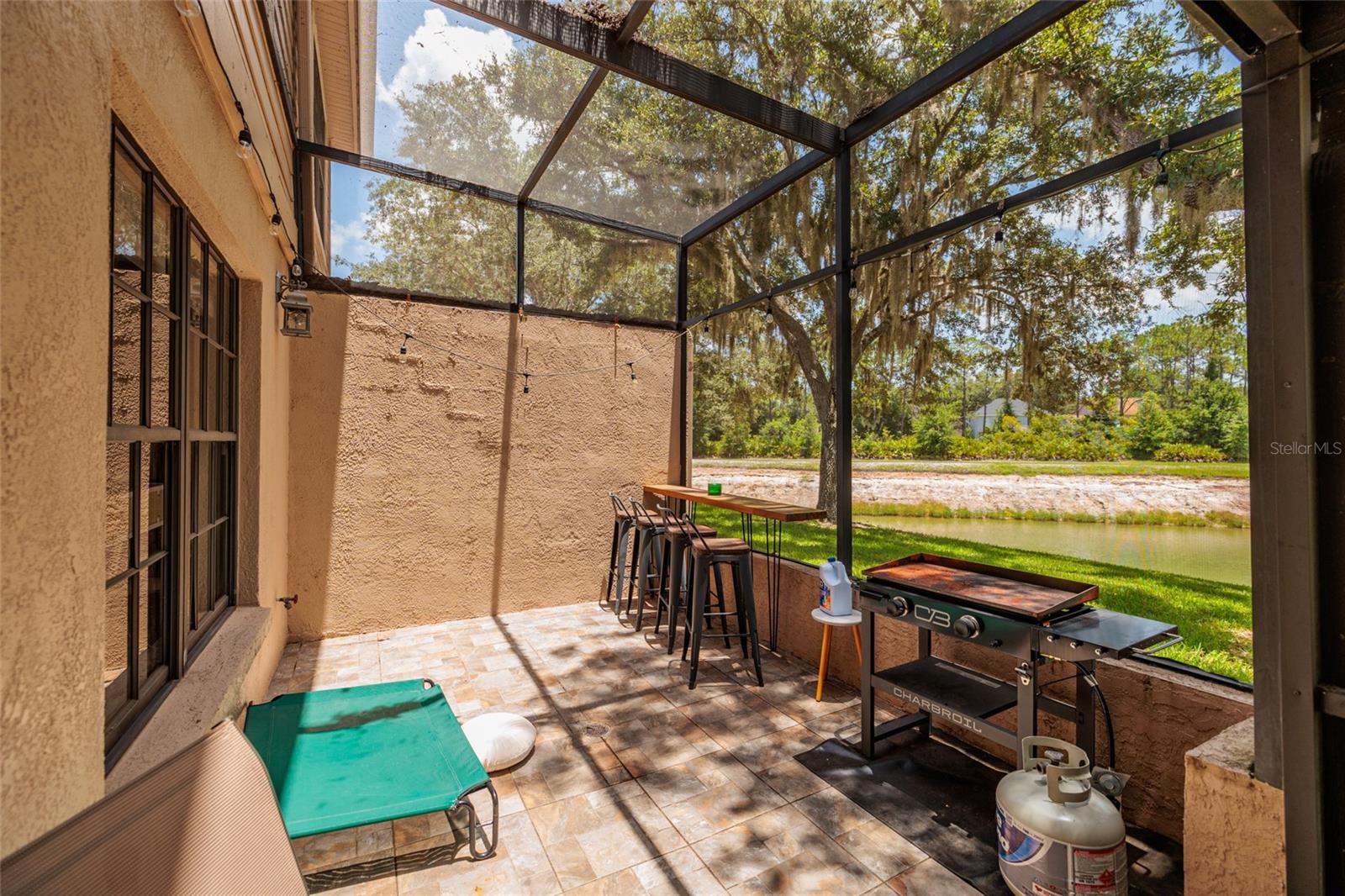 screened in porch with lake view