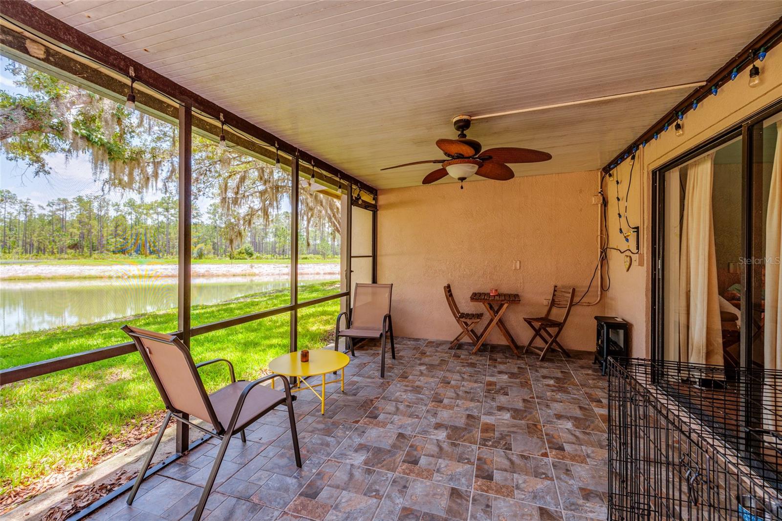 screened in porch with lake view