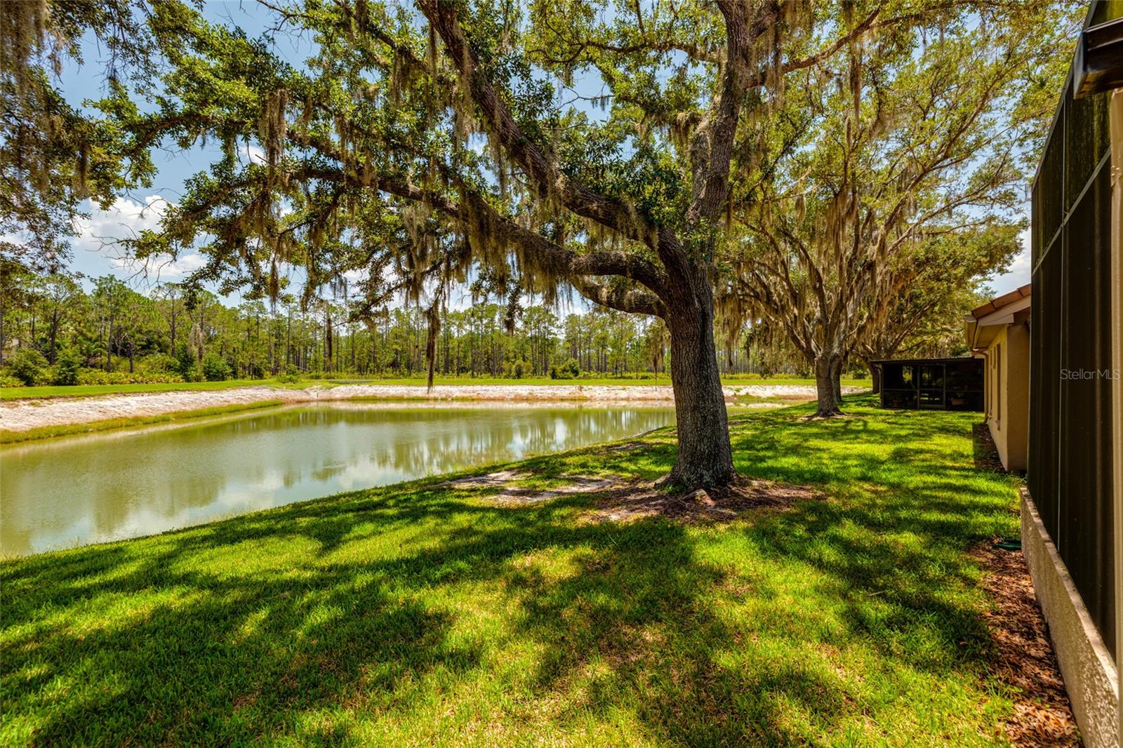 lake and yard view behind unit
