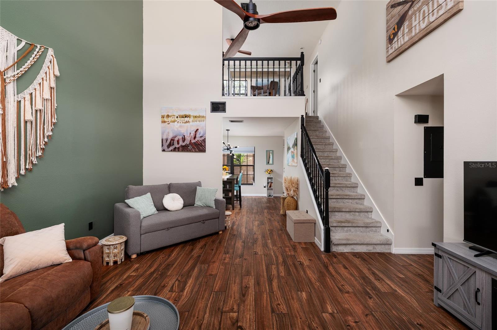 living room with stairs to second floor
