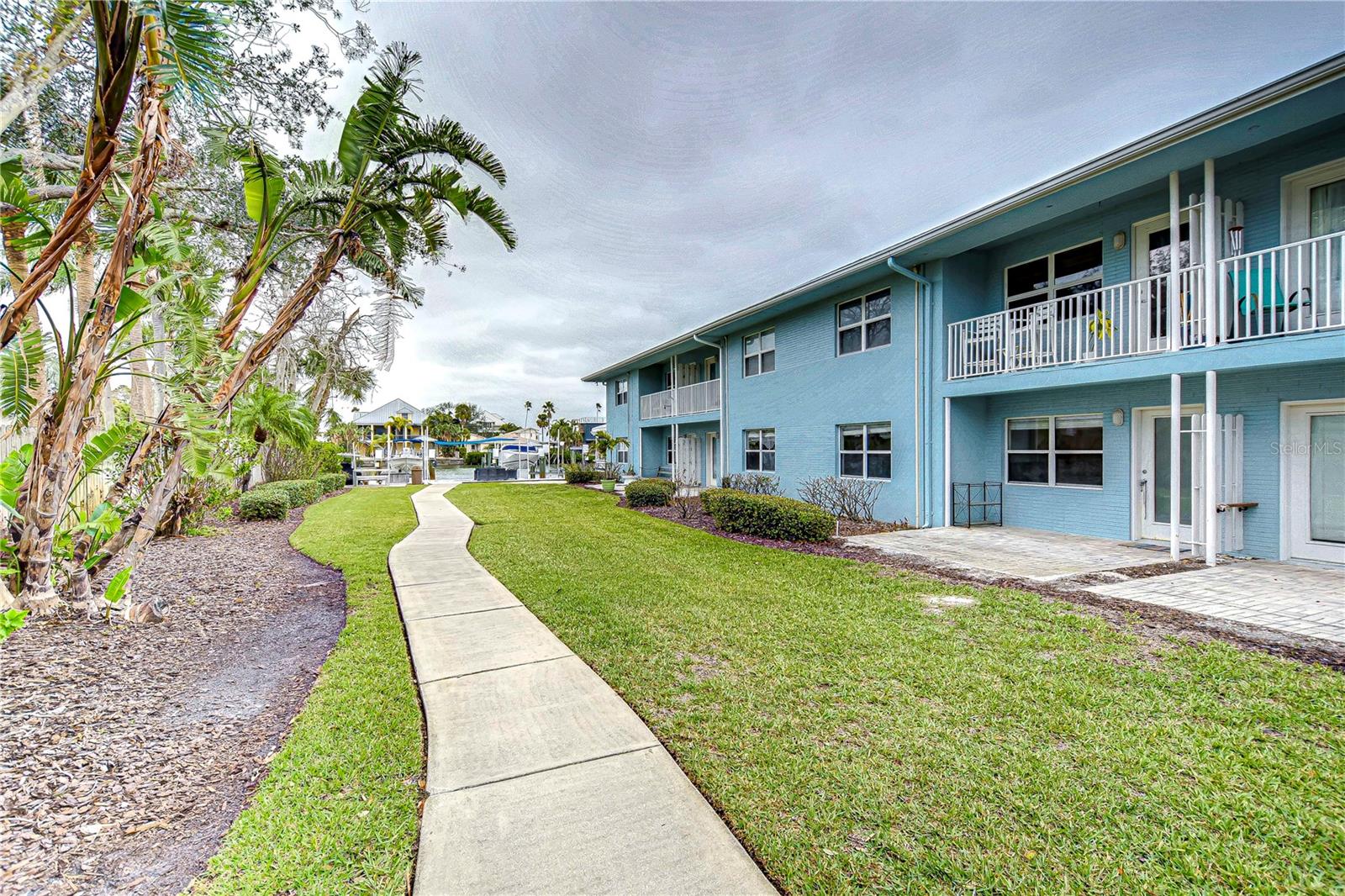 Back Exterior with Walkway to Water