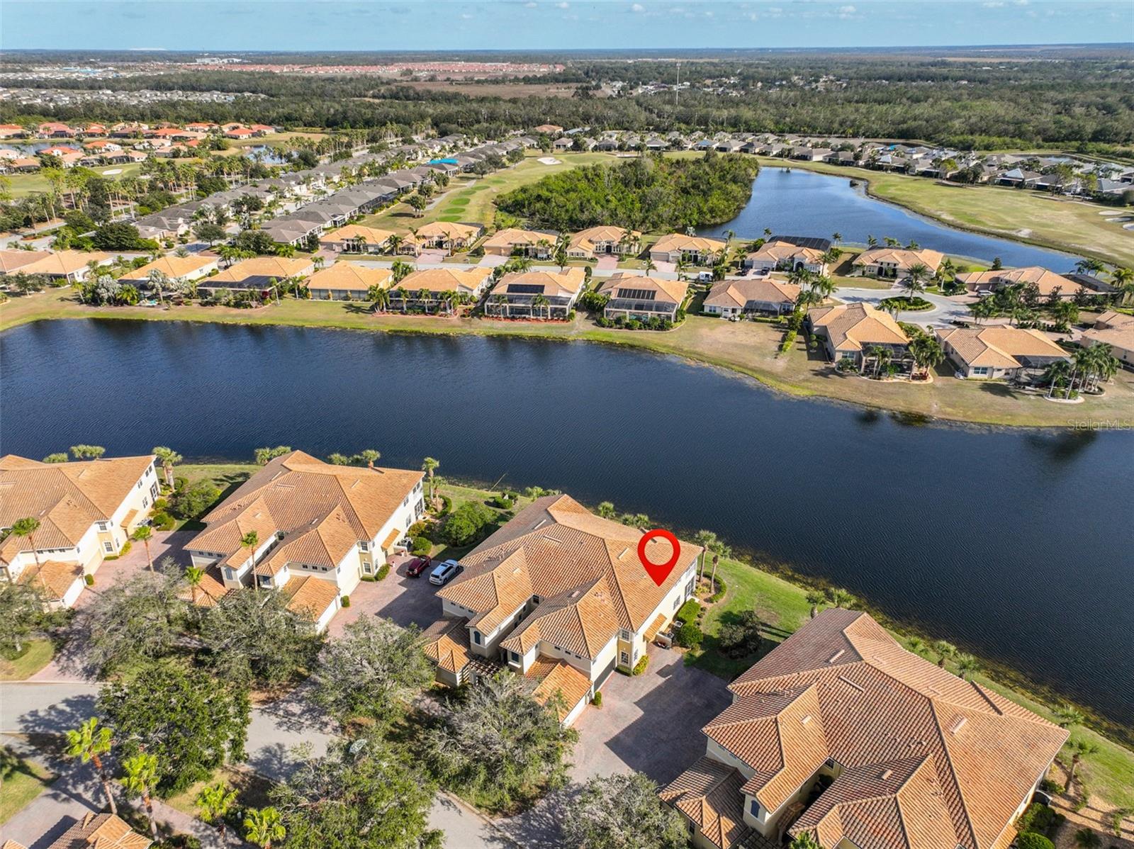 Contemporary, corner condo right on the water with the Renaissance Golf course in the distance.
