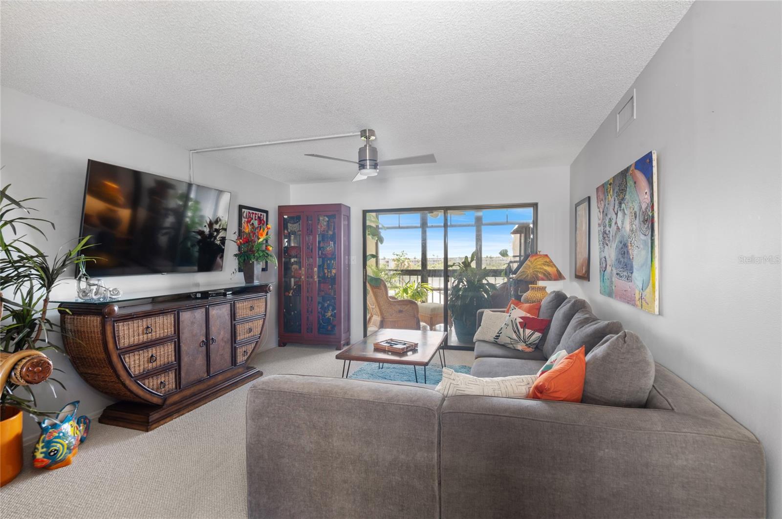Living room with slider tobeautiful lanai