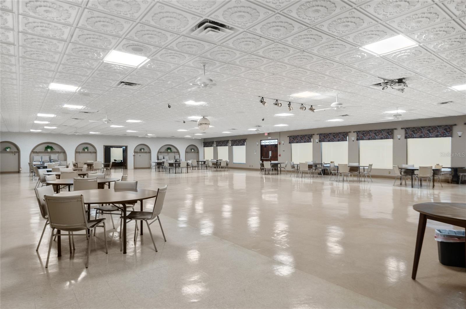 Auditorium with stage, fullkitchen, and connected loungeoffers space for meetings,dances, parties, and more