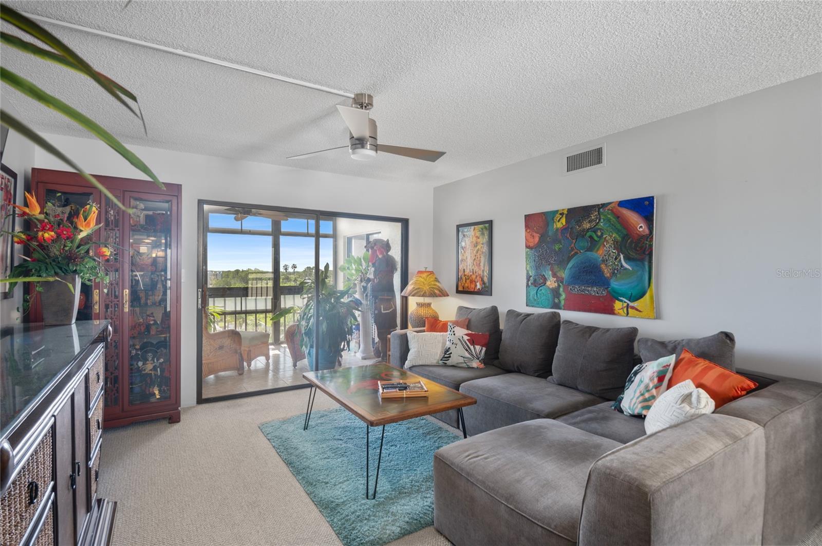 Living room with slider tobeautiful lanai