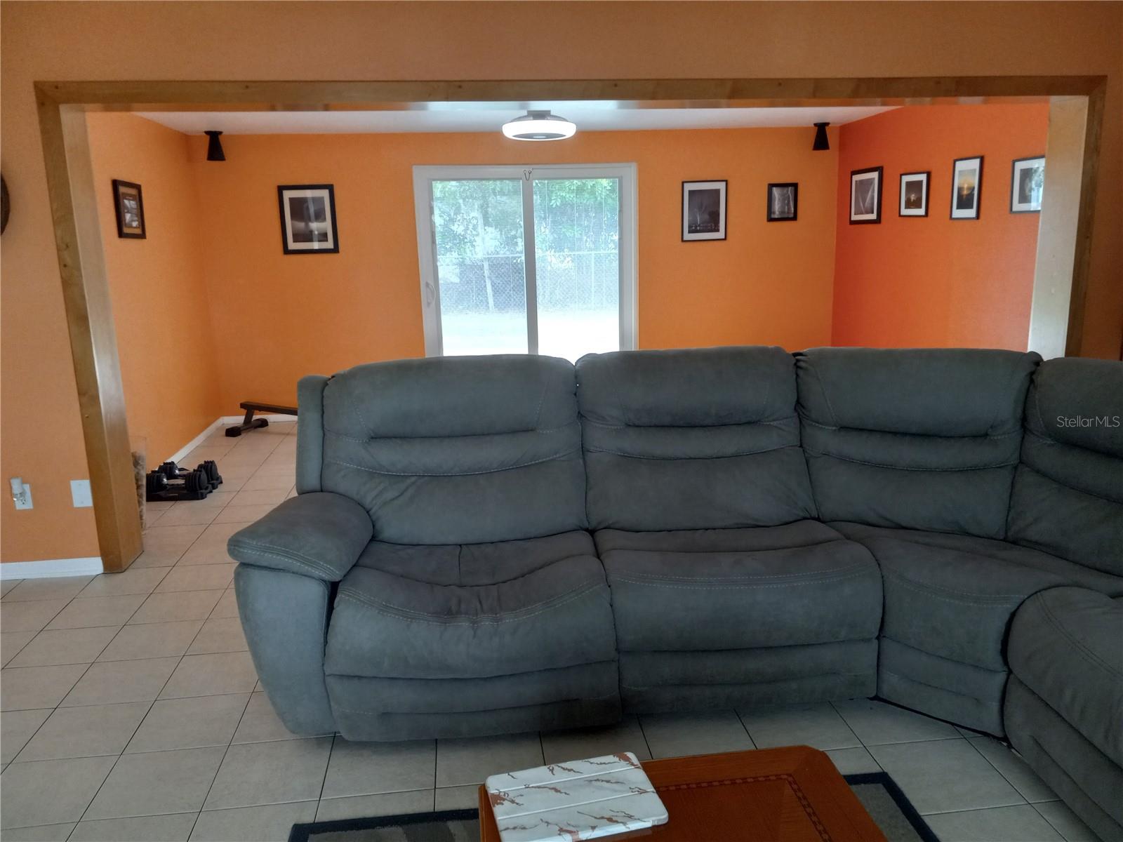 Living room opens to 10 x 17 family room with sliders