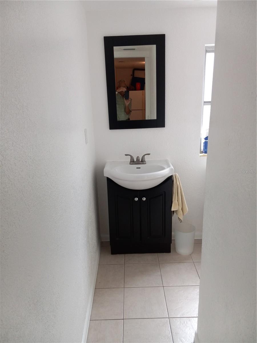 3 piece 2nd bath with shower stall, updated toilet and vanity, off laundry room