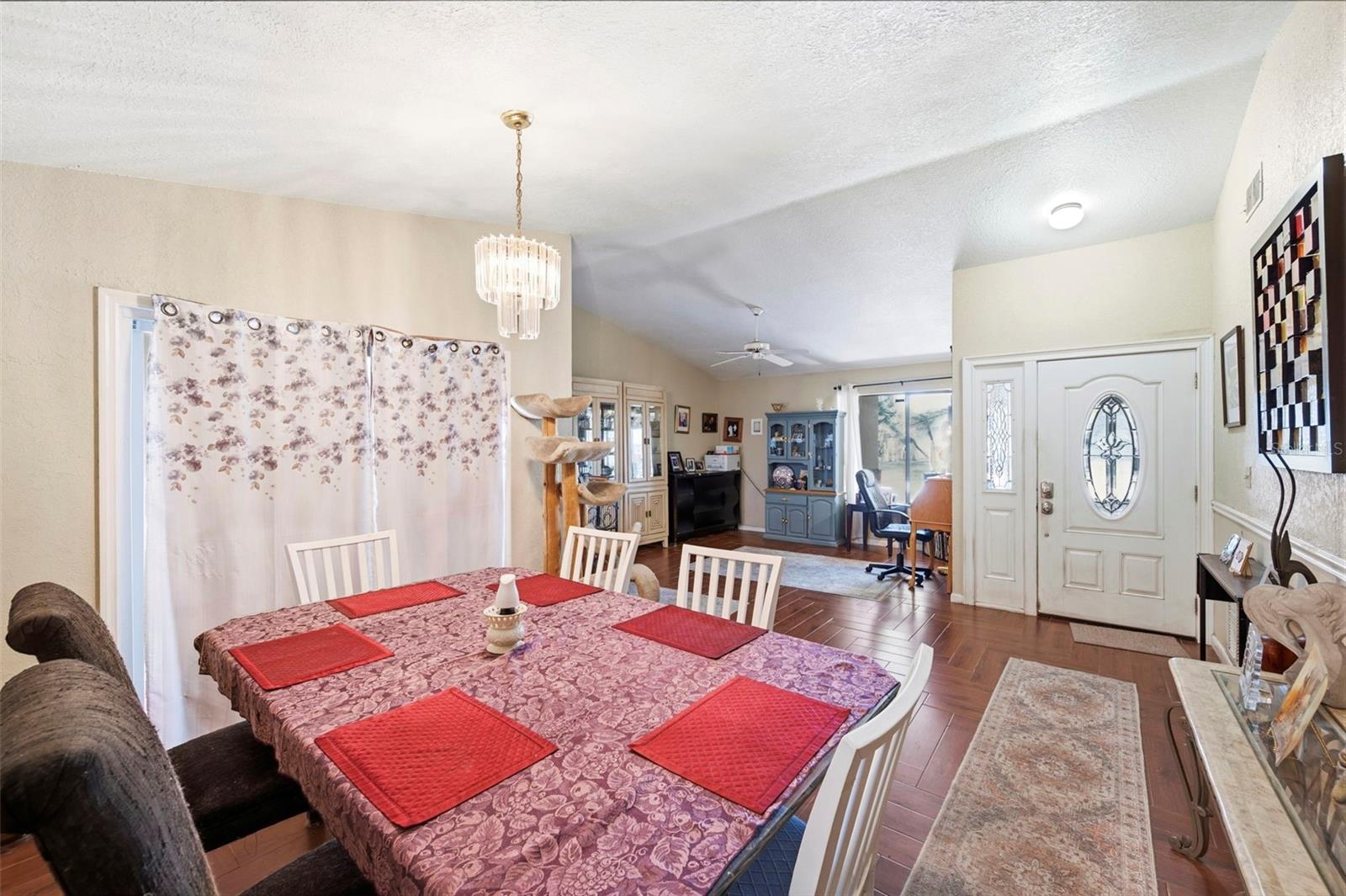 Dining room/living room combination feature sliders to the patio