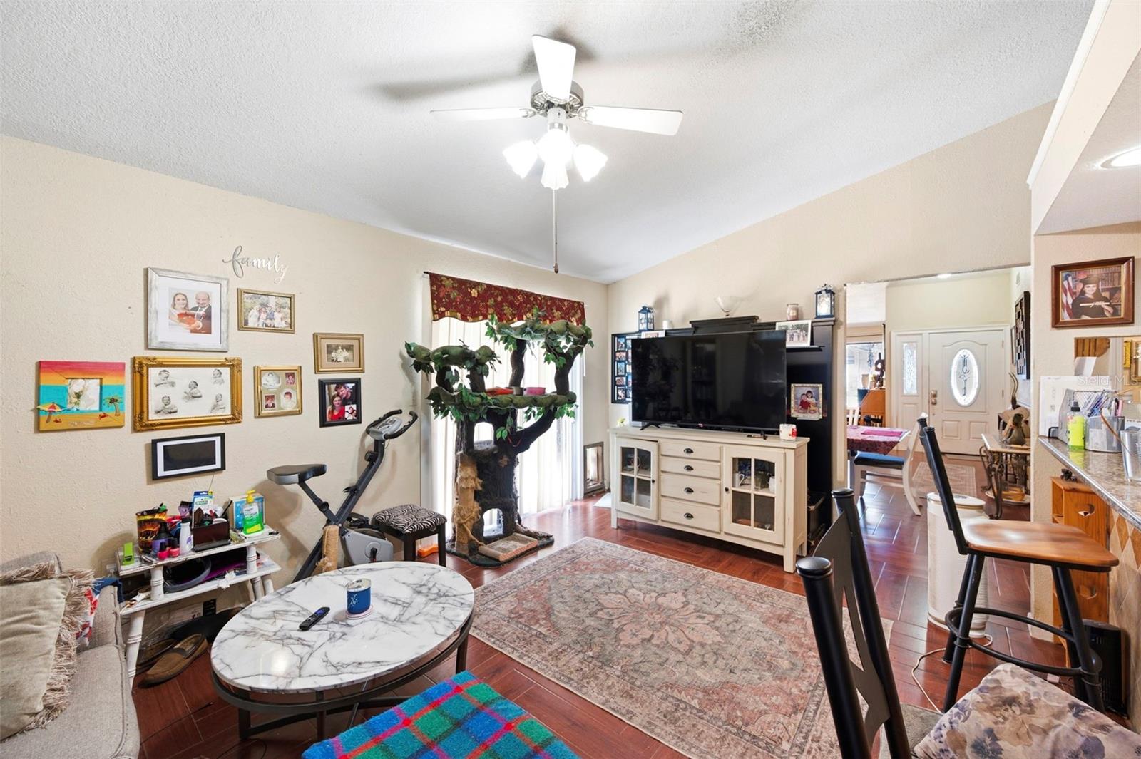 Family room/kitchen combo with sliders to the patio