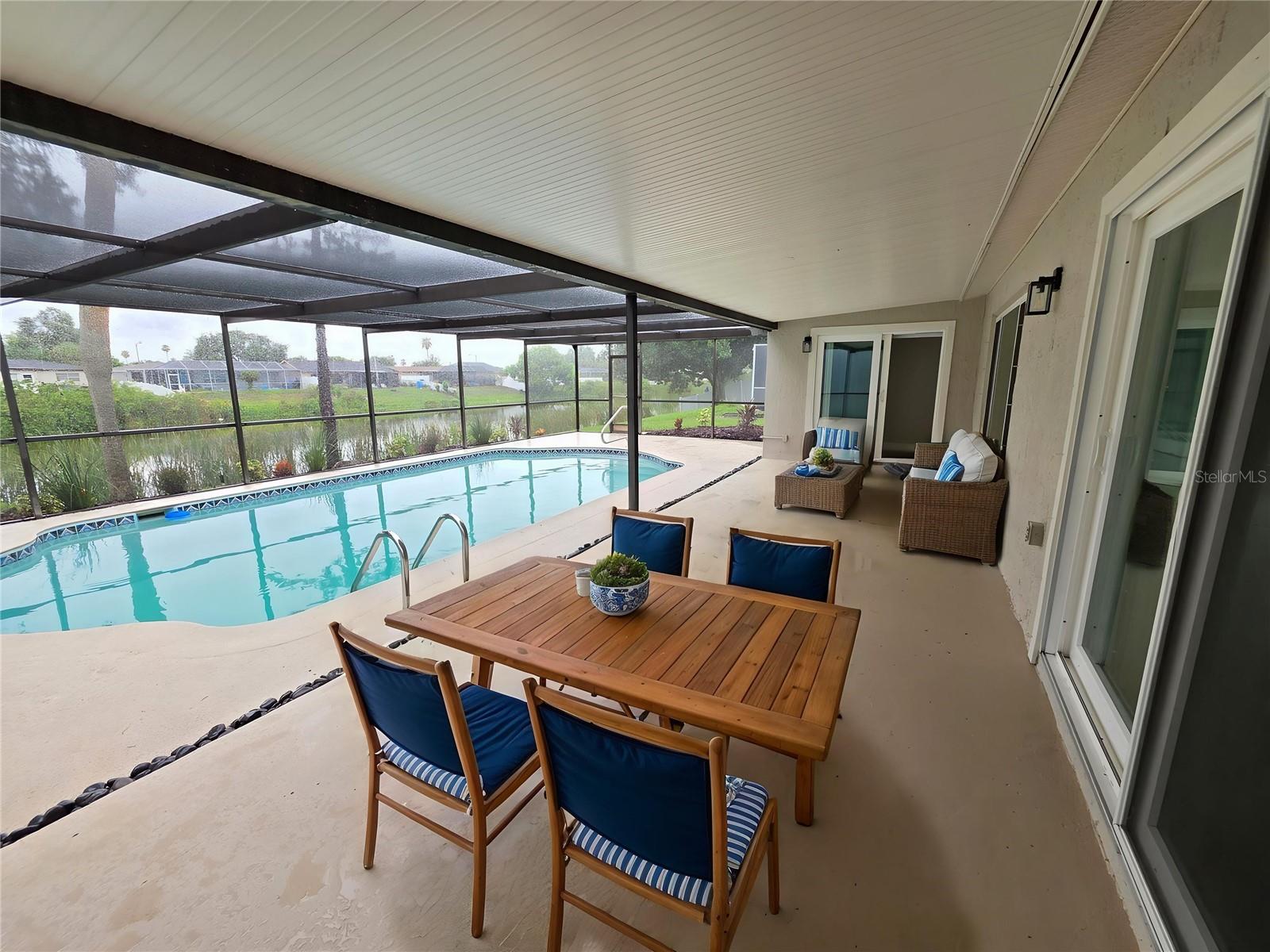 Virtual Staged Patio and Screened Pool.