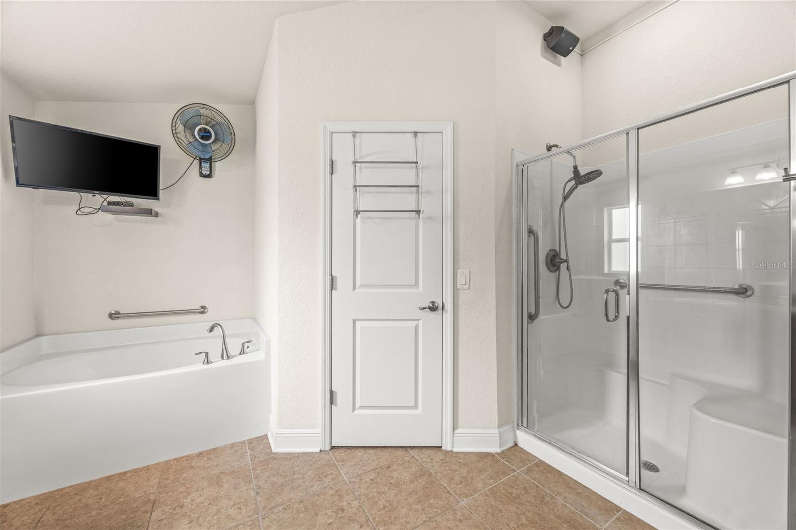 Garden tub and separate shower with built-in seat