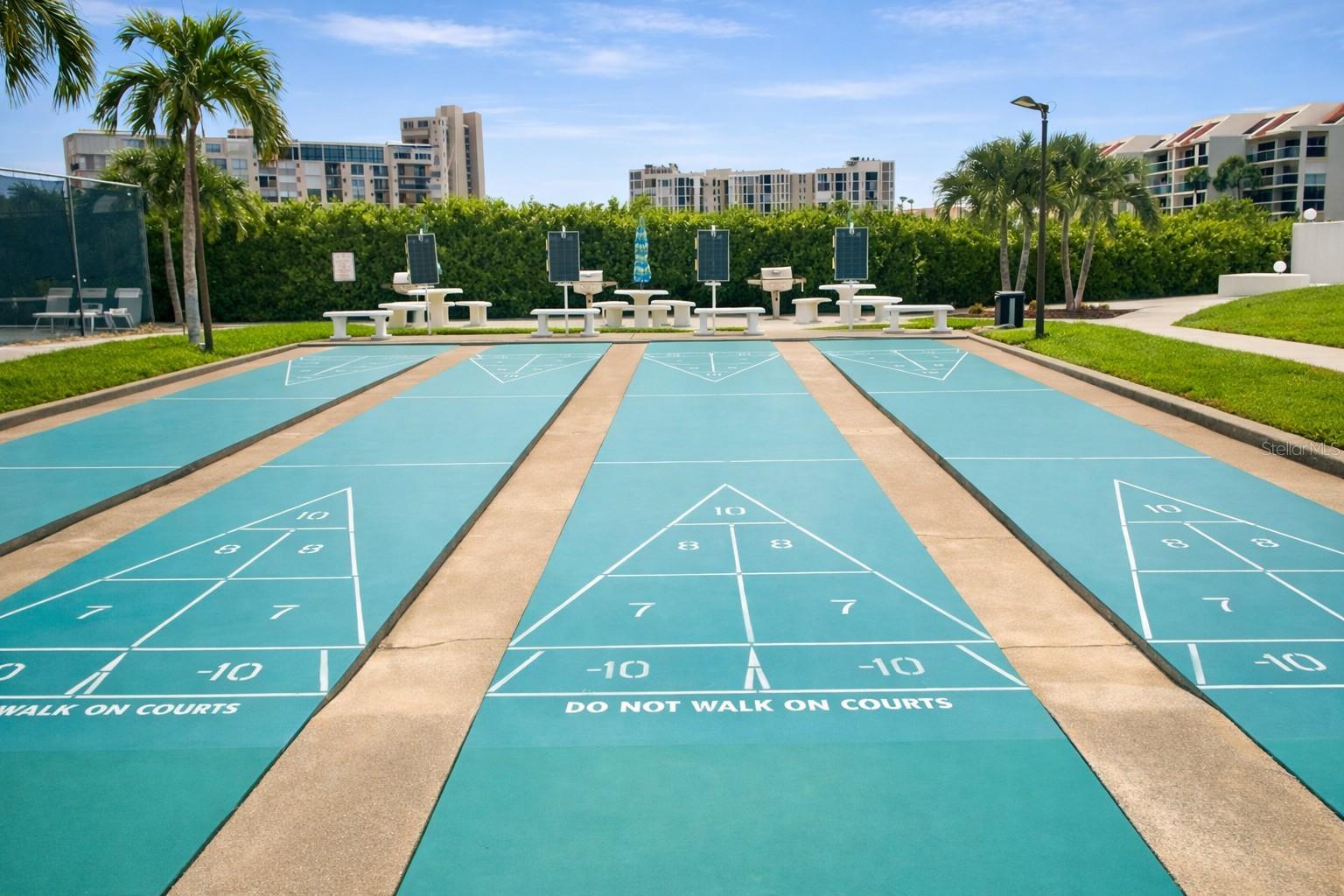 Shuffleboard courts. Outside dining area with gas grills.