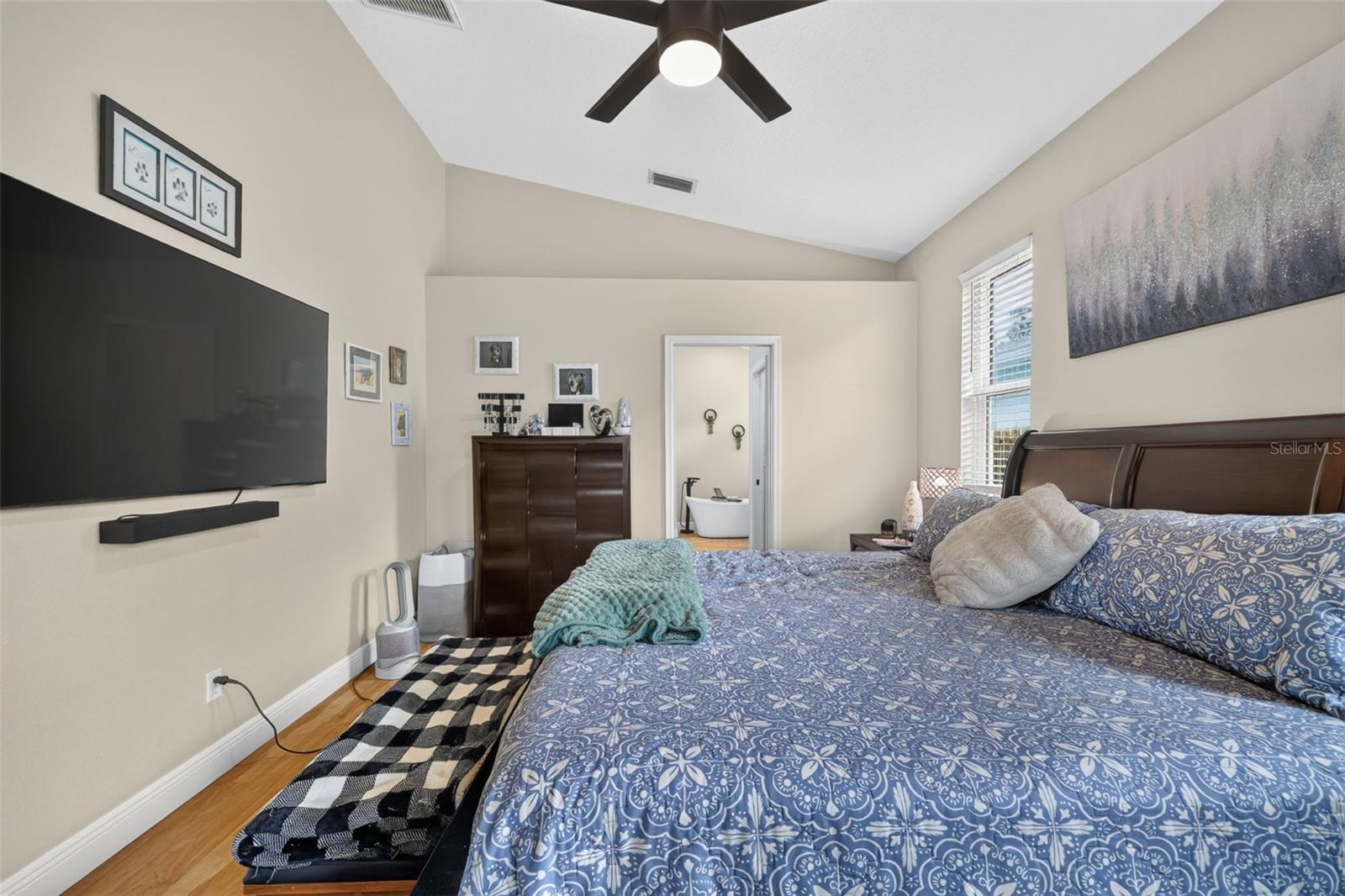 Primary bedroom with EnSuite bath and large walk in closet