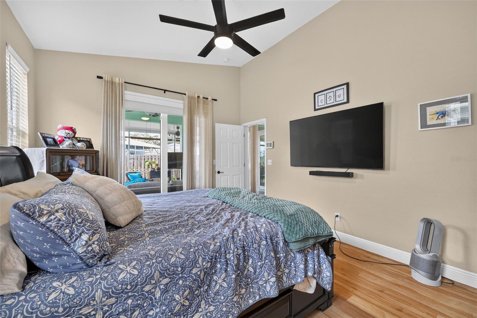 Another view of the Primary bedroom showing the Slider leading out to the lanai