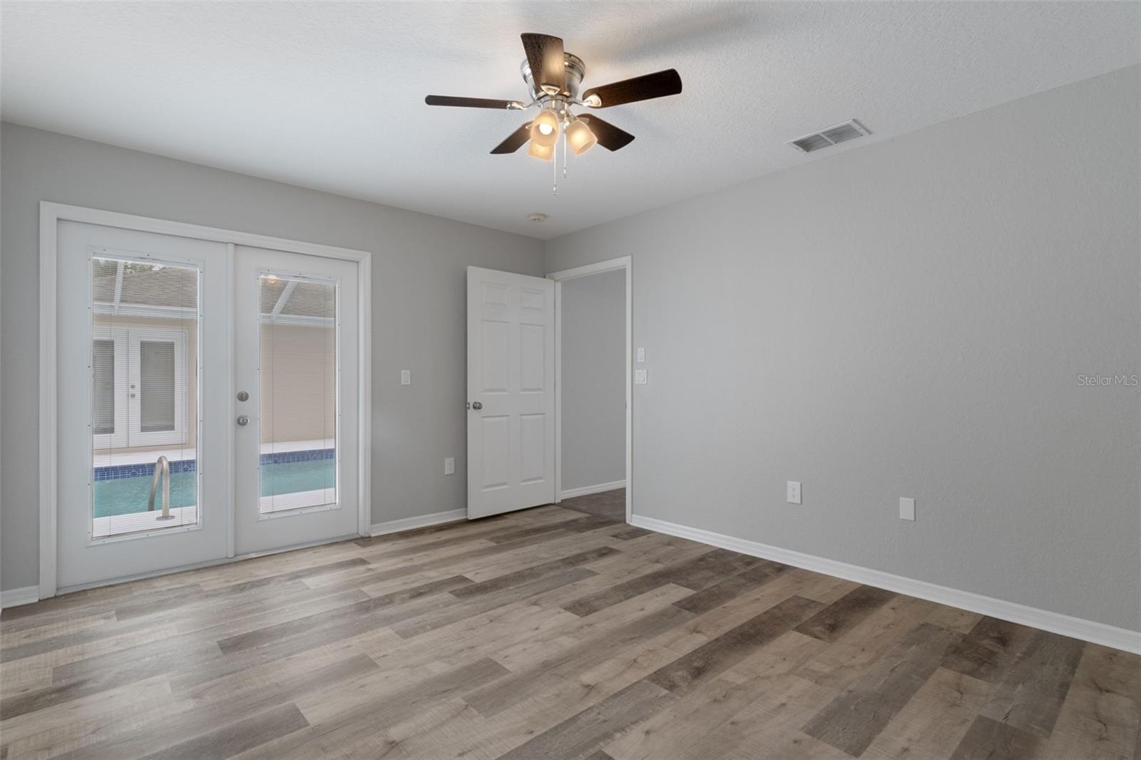Primary Bedroom with entrance to Pool