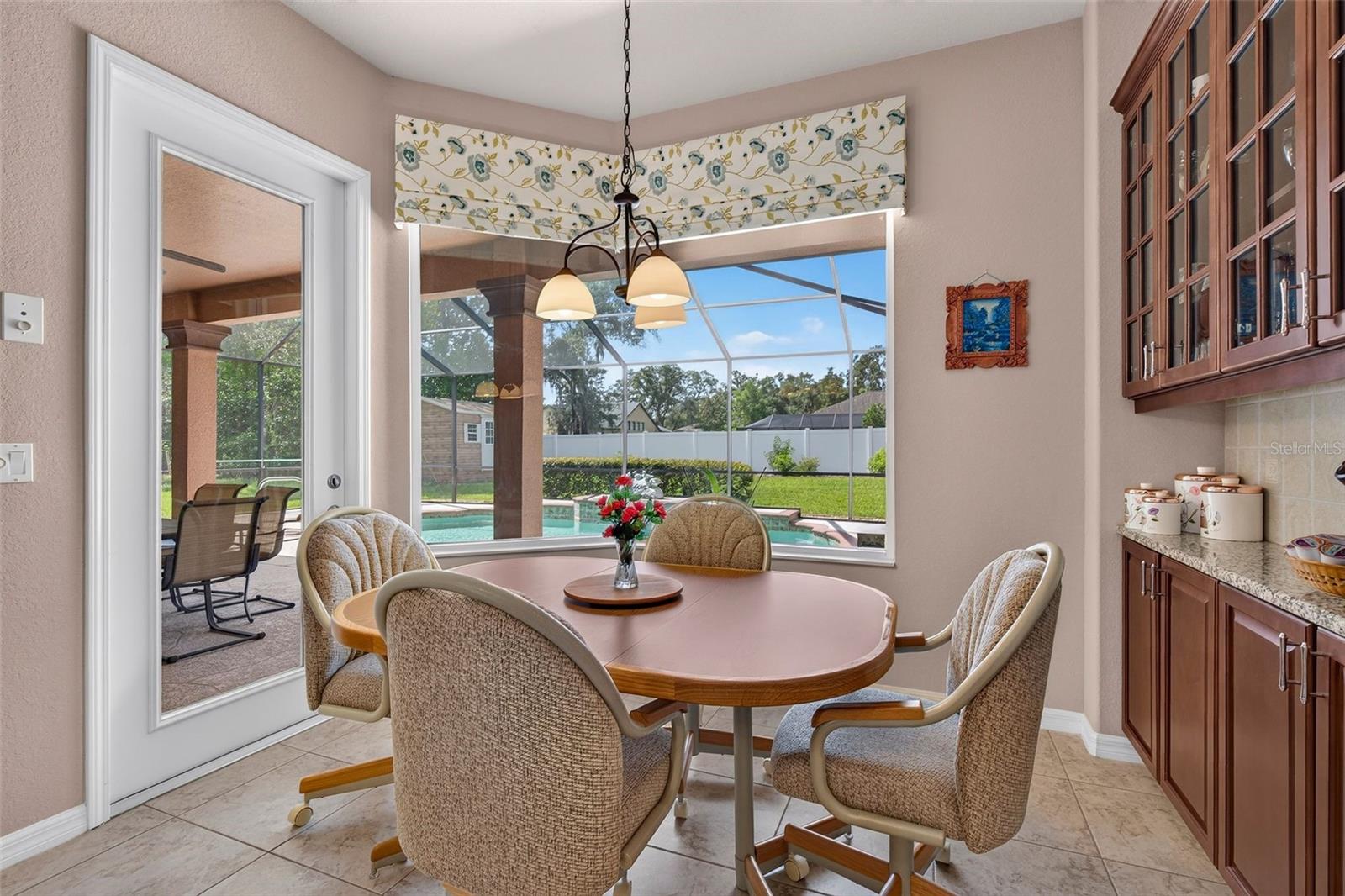 Breakfast Nook with Pool Views & Built in Hutch