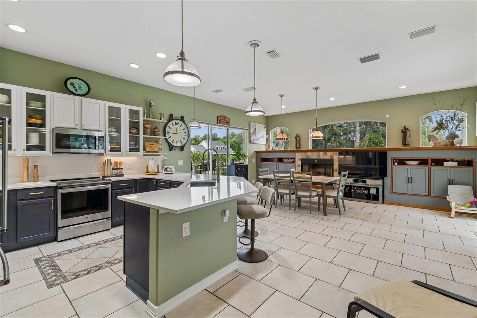 an amazing gathering space is an amazing gathering space with Smart Home Active Surround Sound and Entertainment Area and doors to the Pool, Outdoor Kitchen and Courtyard and Firepit.