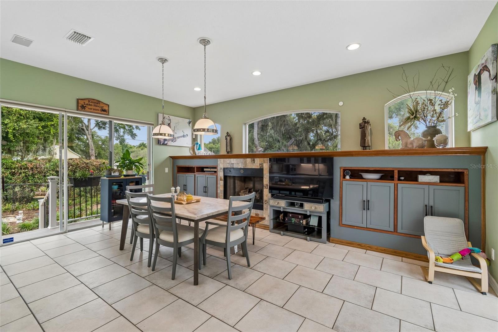 The Dining Room has a Gas Fireplace, Surround Sound and Custom built-ins for Electronics and Extra Storage.