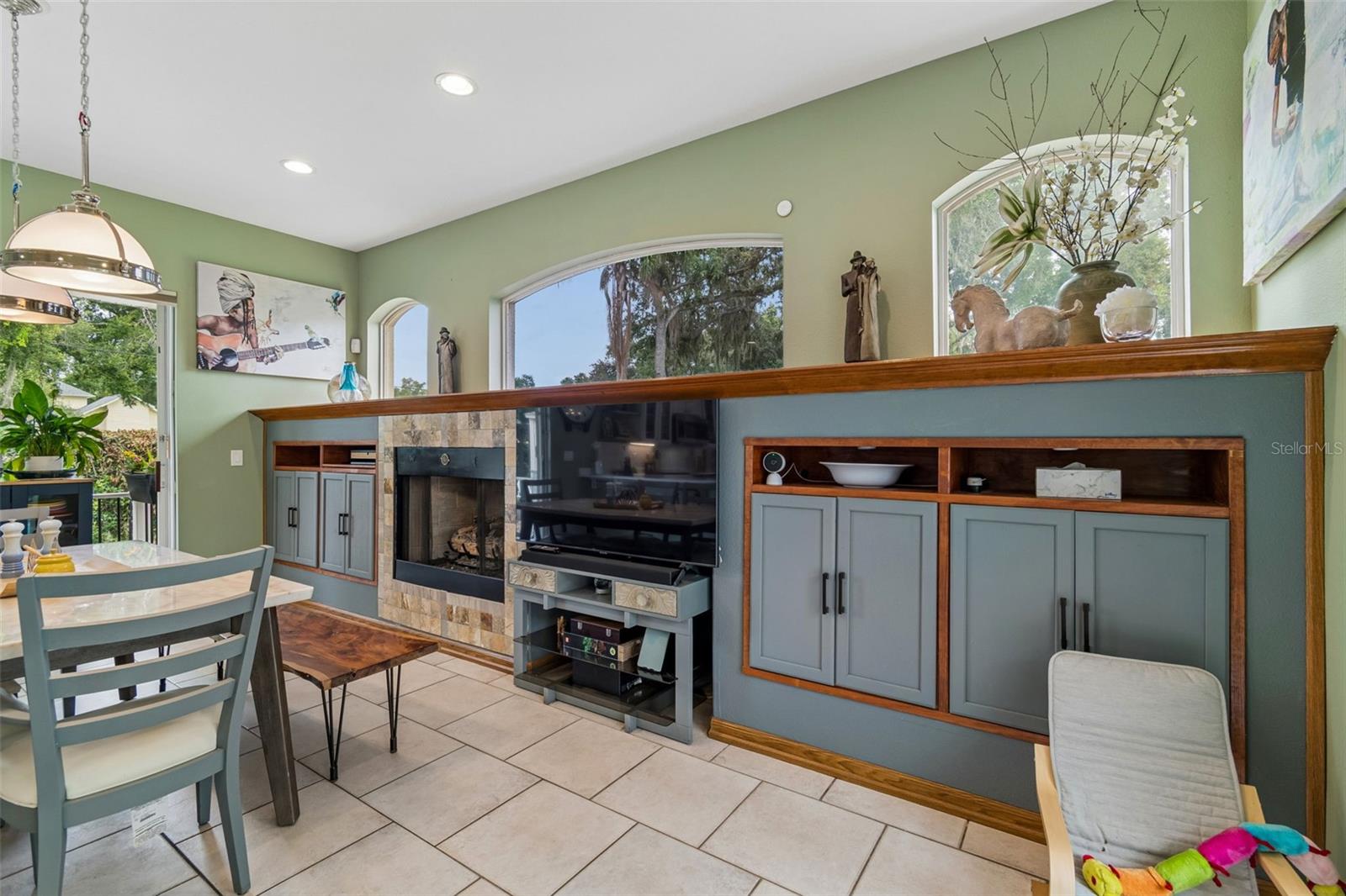 Triple, Pocketing Sliders lead to the Courtyard, Pergola and Fire Pit.