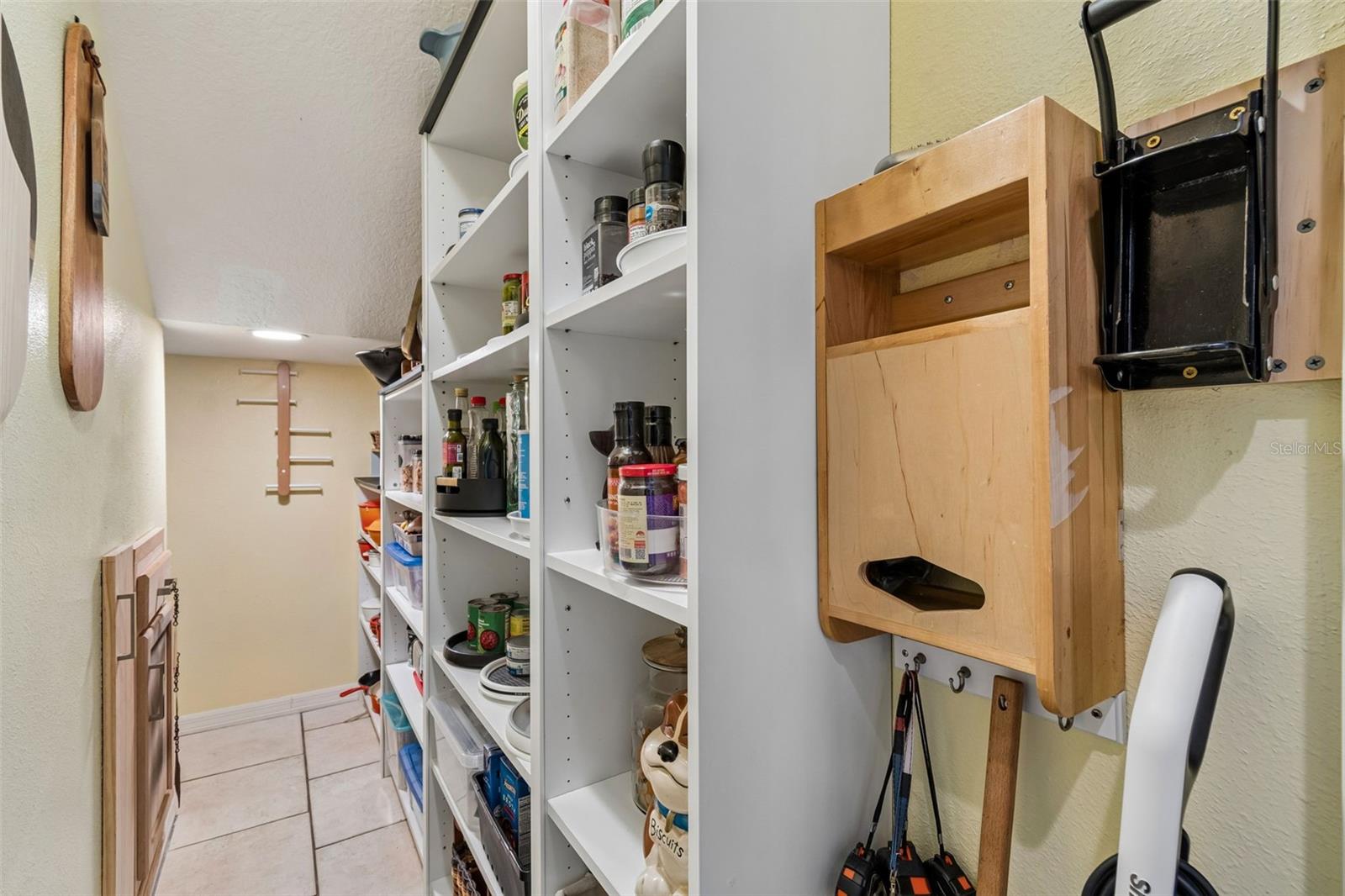 This Huge Pantry has Built-in Shelves, Drawers and tool storage to Maximize Space and Organization.