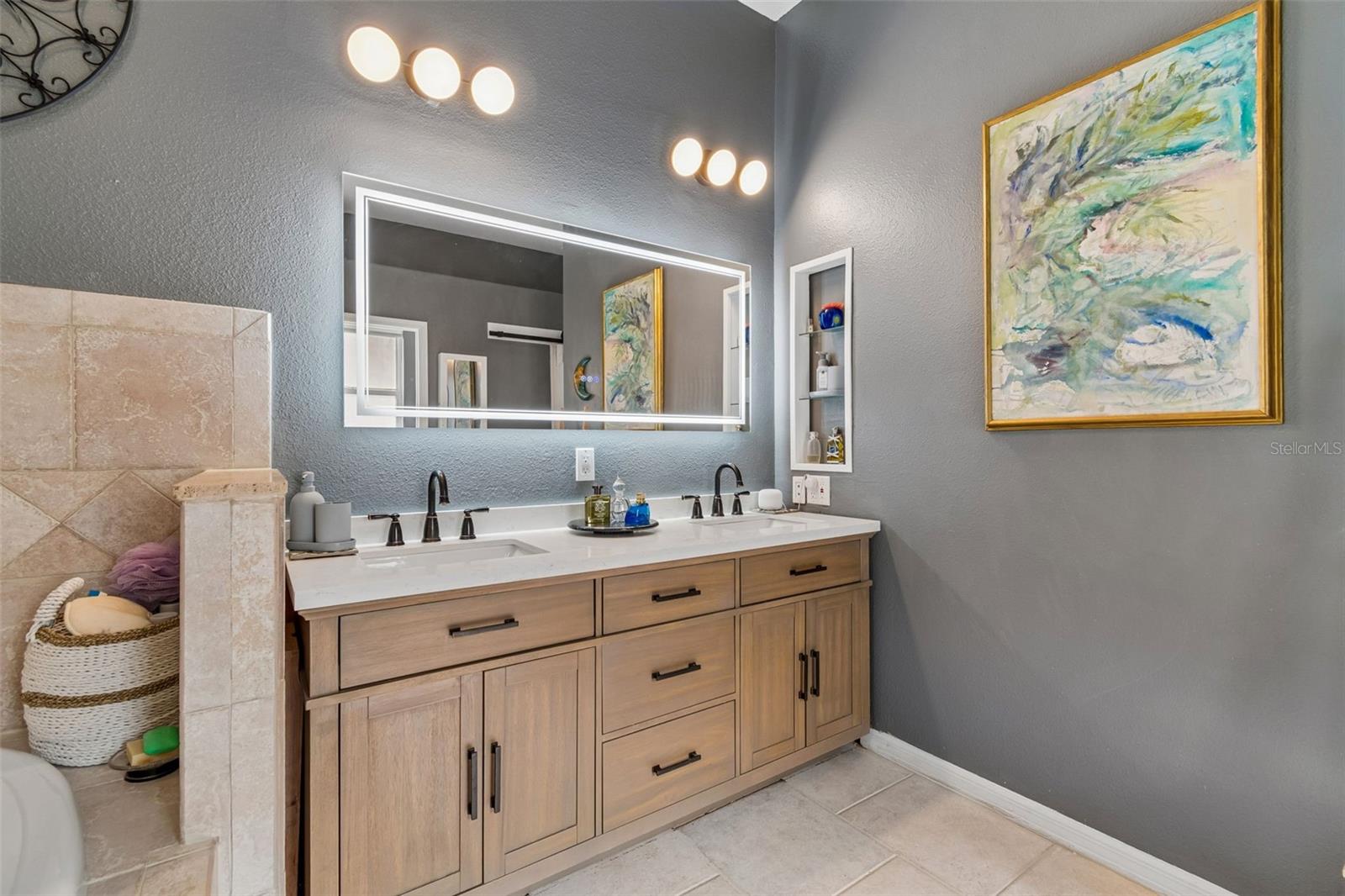 Updated Double Vanity in the Primary Ensuite with Backlit Mirror