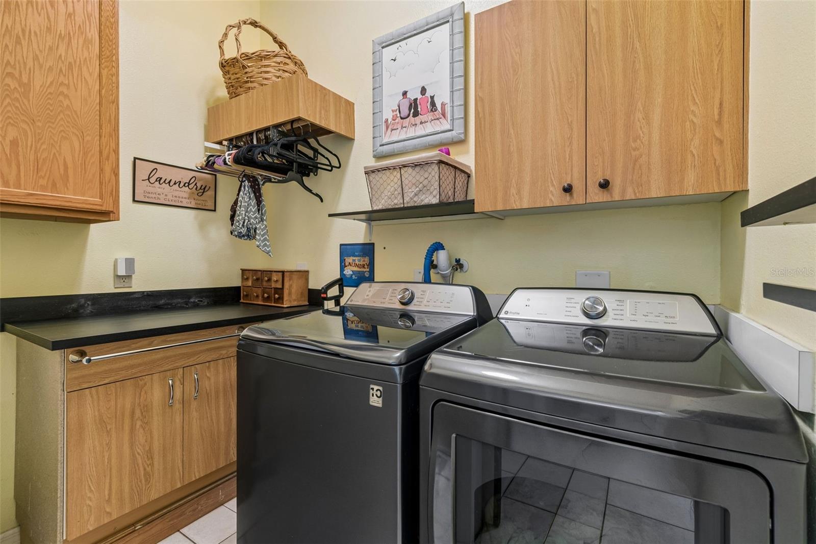 Laundry is easy in this 1st Floor Laundry Room has New Folding Table with lots of Storage