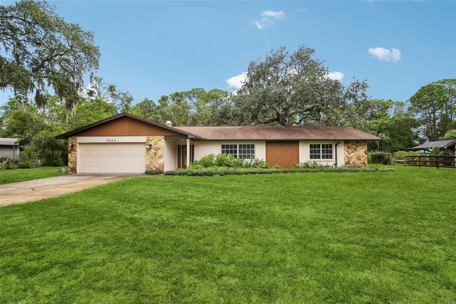 Front entry to one-acre lot; vrtually shaded lawn
