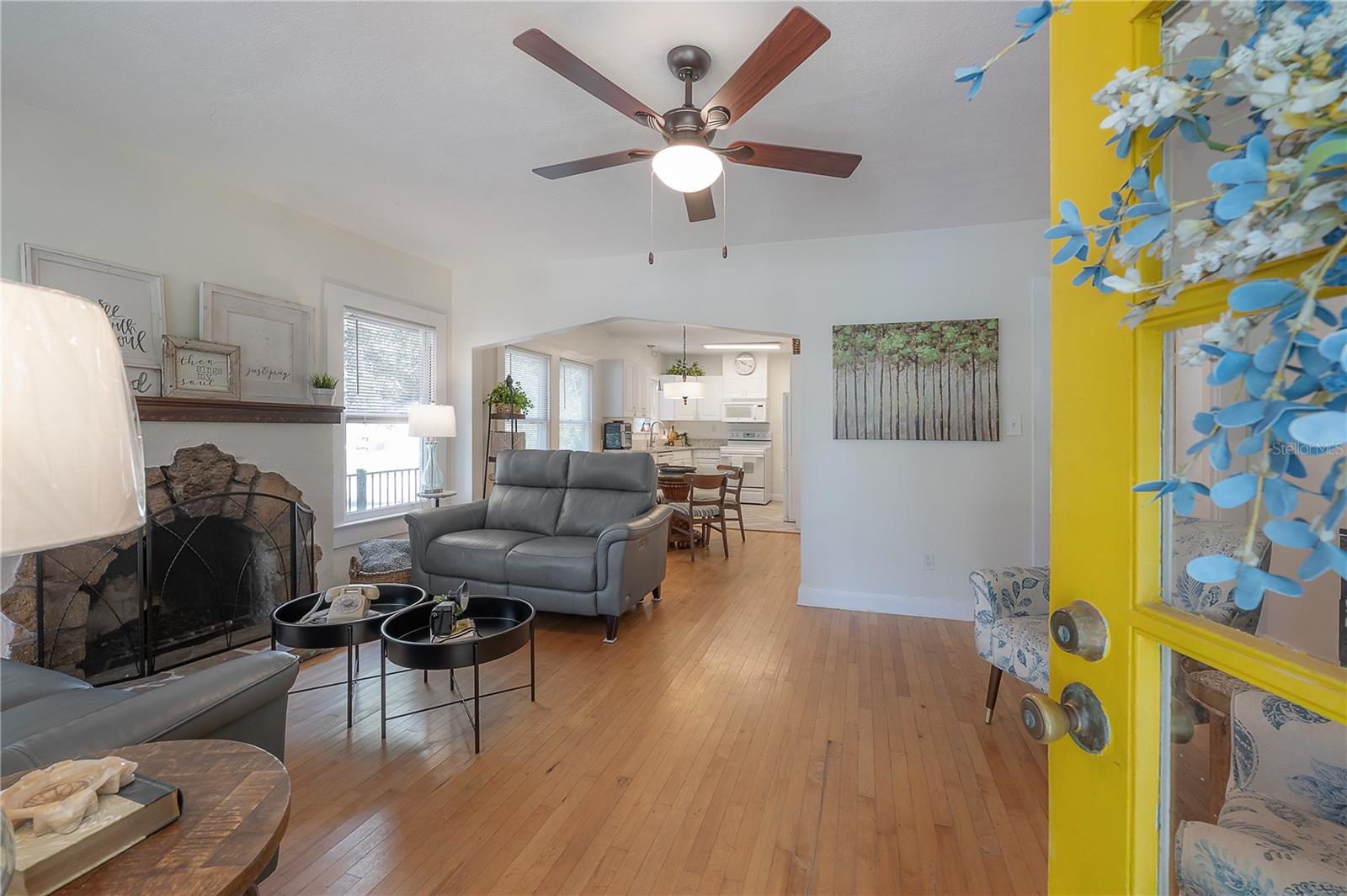 The spacious living room is exceptionally generous for a bungalow-style home and features a stylish wood-burning fireplace.