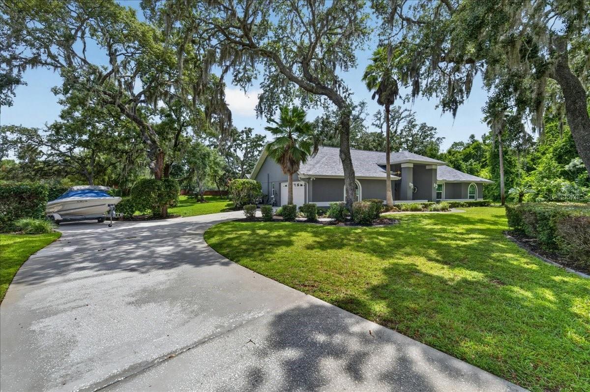 The long, extended driveway adds to the home’s curb appeal while offering the flexibility of a convenient turnaround or space for boat parking.