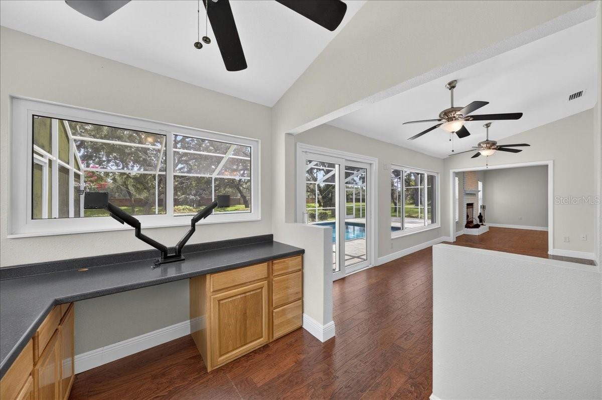 An adjoining office or hobby area provides generous counter space and storage cabinetry for working, creating or staying organized.