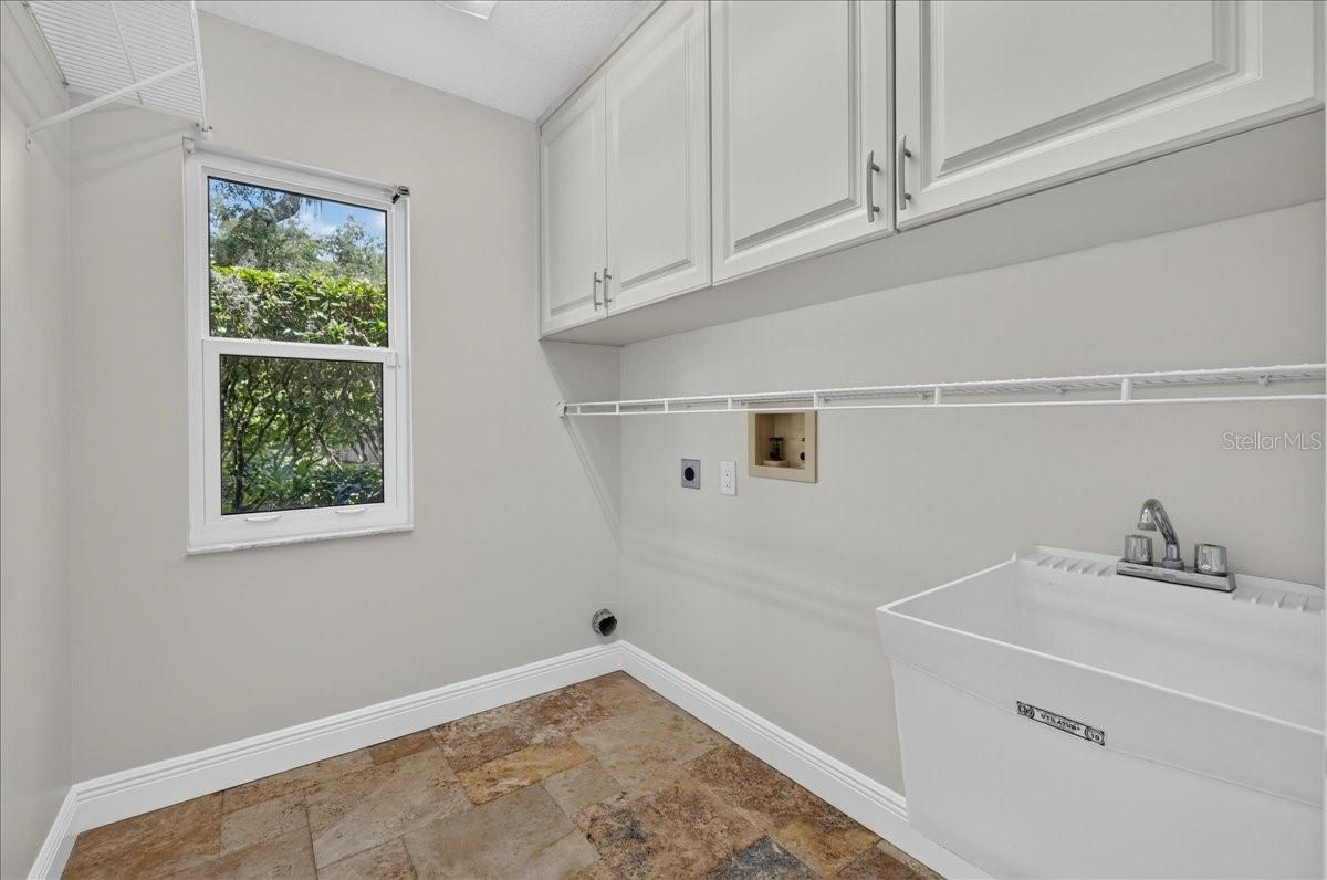 A laundry room off the kitchen adds to everyday convenience.