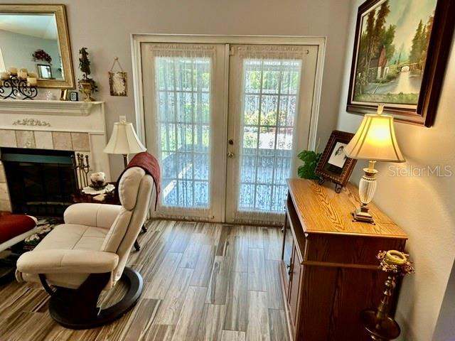 Family room w/ Porecelain Floors that open to Private Sceen Lanai