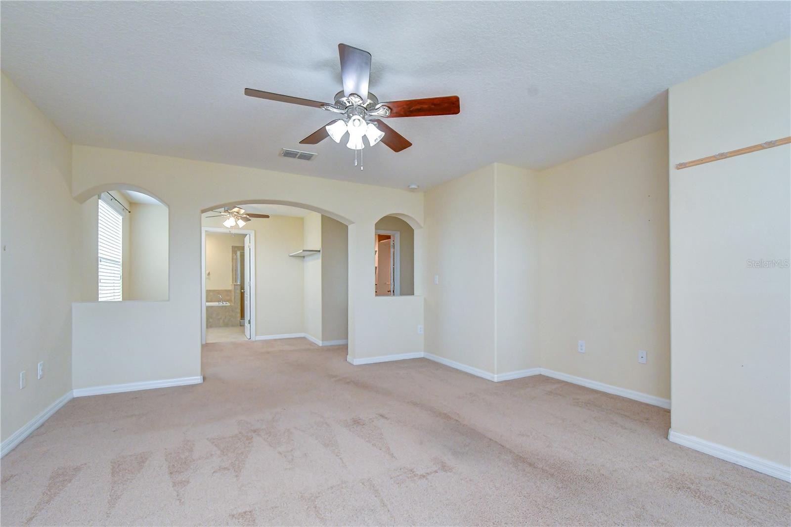Oversize main bedroom w/ sitting area and custom wakin closet.